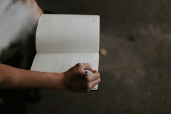 person holding white printer paper