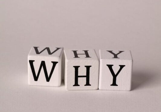 The Word Why Made with Cubes with Letters